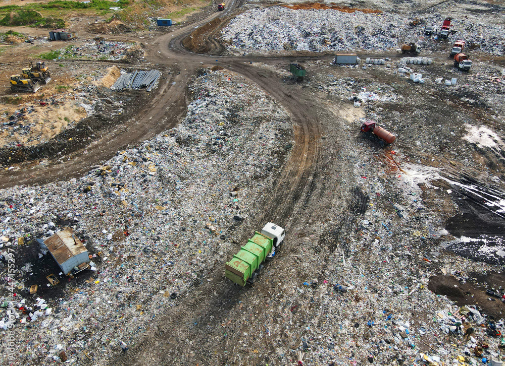 Garbage dump with food waste. Arial view of garbage truck unloads