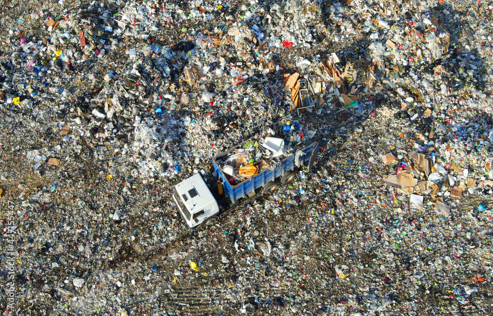 Garbage dump with food waste. Arial view of garbage truck unloads