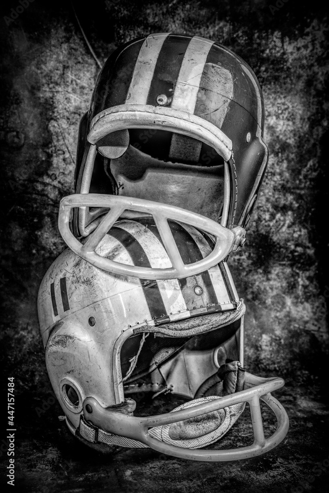 Vintage Boys Football Helmets and Leather Shoulder Pads Stock Photo