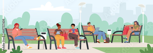 People with Gadgets on Benches in City Park. Men and Women Communicate Online with Mobile Devices. Social Networks