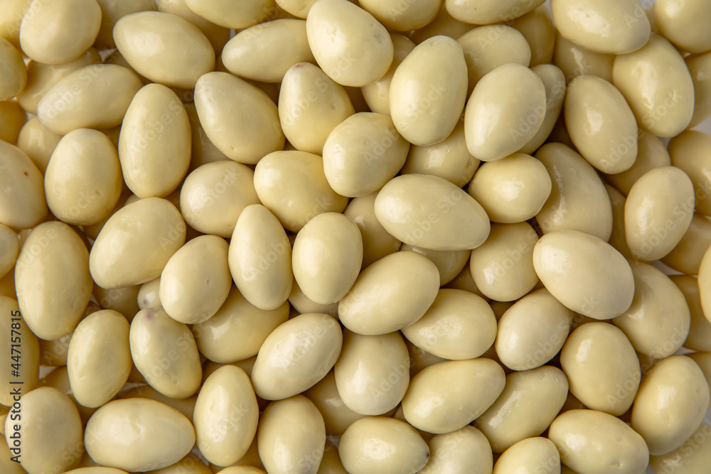 Candies. Almonds in white chocolate. Desserts for candy bars. Little white dragees Candies. Almonds in white chocolate. Desserts for candy bars. Little white dragees