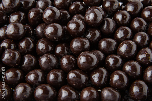 Hazelnuts in dark chocolate, dragees. Desserts for Candybar. Small round candies.