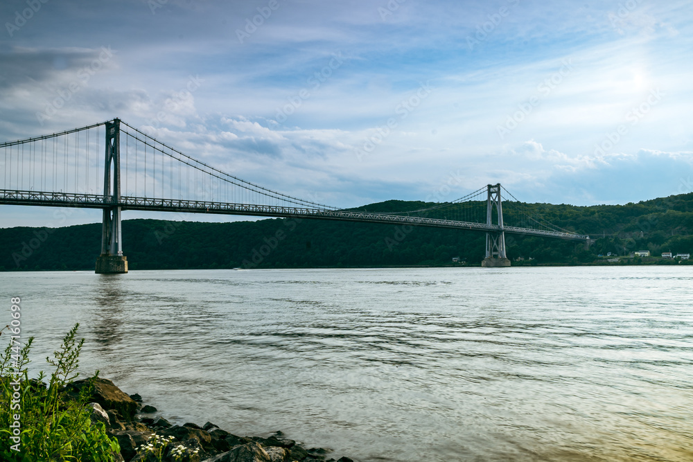 Fototapeta premium Poughkeepsie, NY - USA - July 24, 2021: Horizontal view of The Franklin Delano Roosevelt Mid-Hudson Bridge is a toll suspension bridge which carries US 44 and NY 55 across the Hudson River.