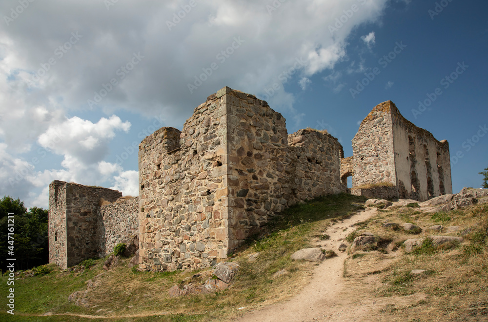 Ruins of an old castle against a blue sky