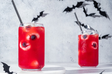 Red halloween cocktail with lychee and blueberry eyeballs