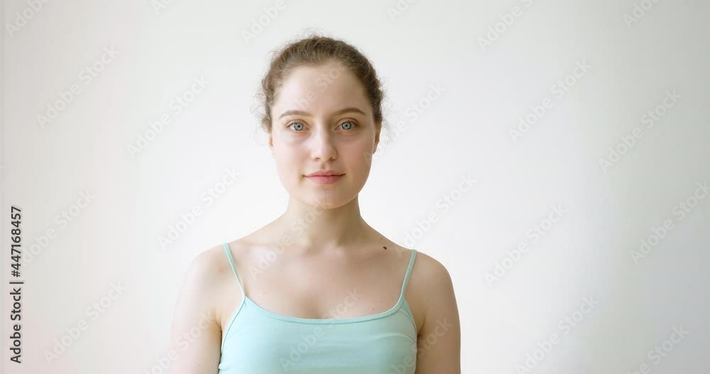 A young girl says yes, smiles and gestures. A young girl says yes, smiles and gestures.