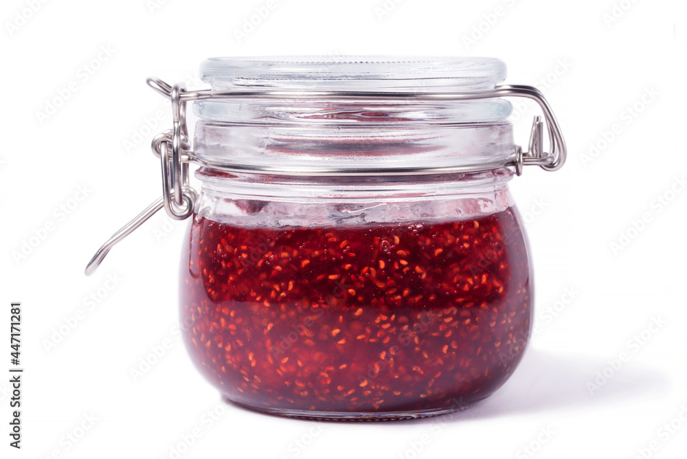 Jar of raspberry jam on a white background close up Jar of raspberry jam on a white background close up