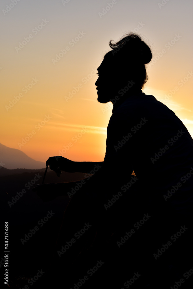 silhouette of a male person in the sunset silhouette of a male person in the sunset