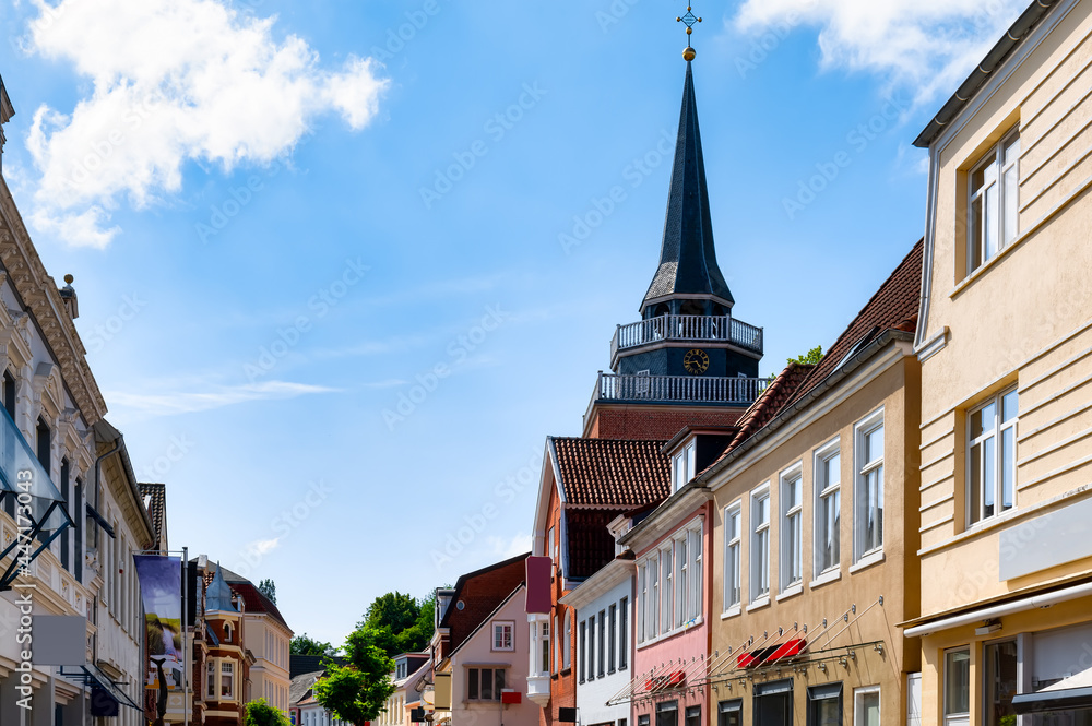 Shopping street with view to the church in the down town of Aurich, Ostfriesland, Germany