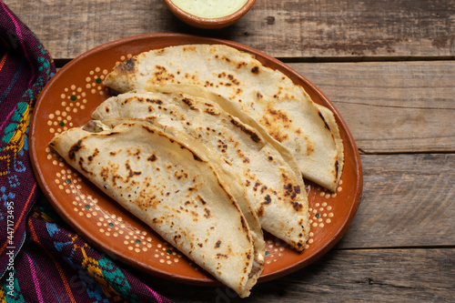 Mexican food. Quesadillas on wooden background