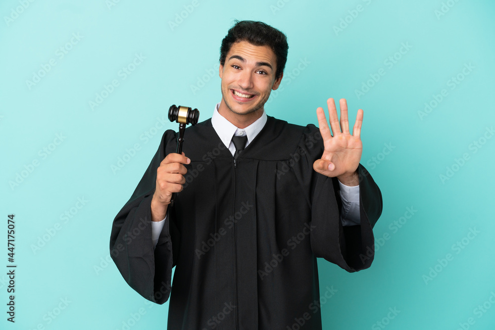 Judge over isolated blue background happy and counting four with fingers Judge over isolated blue background happy and counting four with fingers