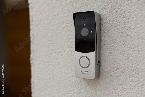doorbell on the wall of the house with a surveillance camera Fototapeta