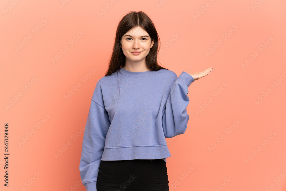 Young Ukrainian girl isolated on pink background having doubts Young Ukrainian girl isolated on pink background having doubts