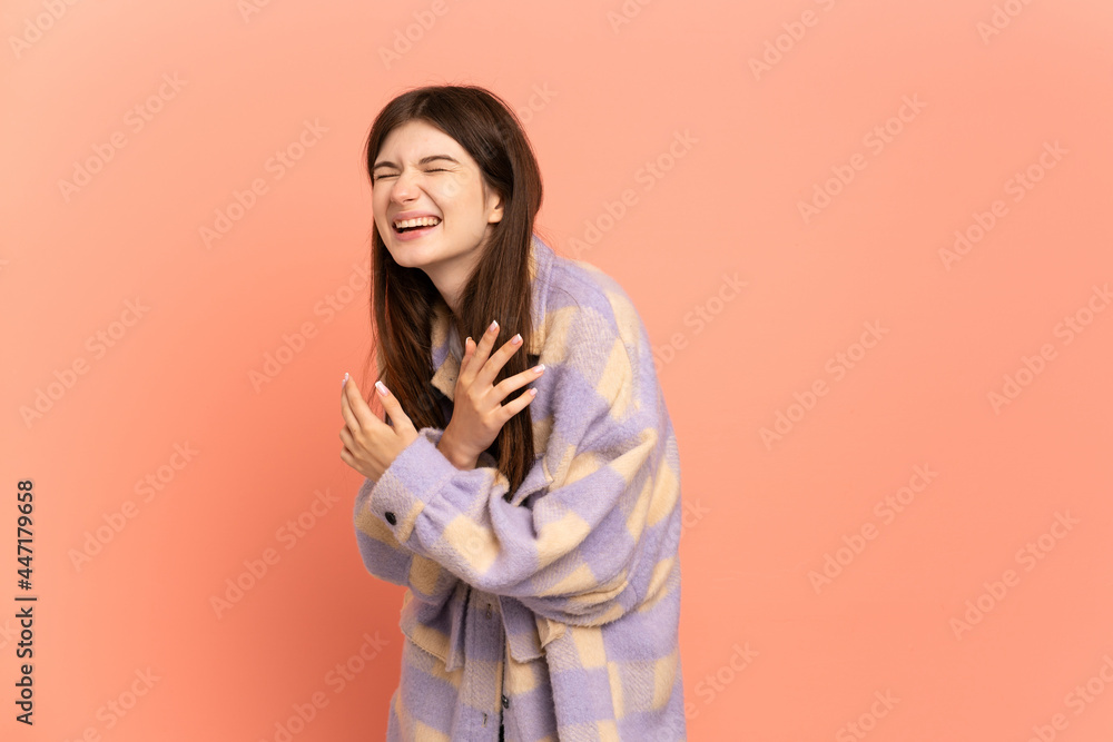 Young Ukrainian girl isolated on pink background smiling and showing victory sign Young Ukrainian girl isolated on pink background smiling and showing victory sign