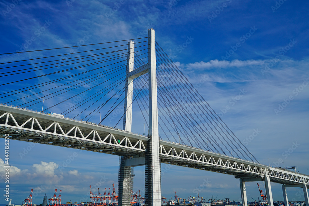 Looking up at the Yokohama Bay Bridge from the boat. Cruise on Looking up at the Yokohama Bay Bridge from the boat. Cruise on