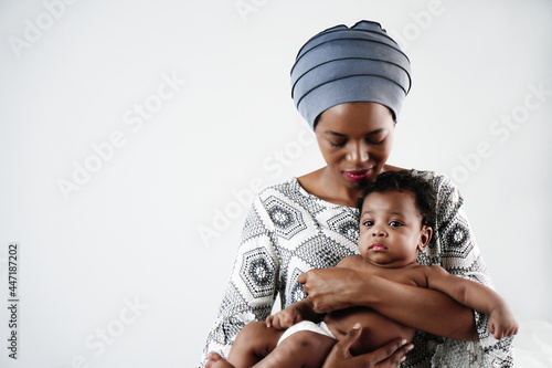 african american mother holding her adorable infant baby son
