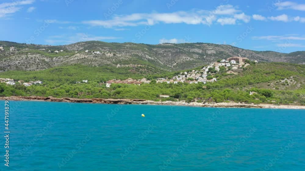 POV boat ride with speed boat on beautiful blue sea alongside Alcossebre Valencian Community coastline in Spain, Europe. POV boat ride with speed boat on beautiful blue sea alongside Alcossebre Valencian Community coastline in Spain, Europe.