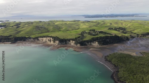 Aerial view of Motutapu Island, New Zealand. Small island used for ecological farming. Coastal landscape photo