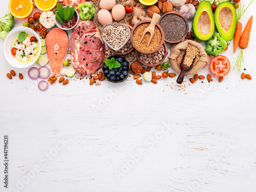 Ketogenic low carbs diet concept. Ingredients for healthy foods selection set up on white wooden background.