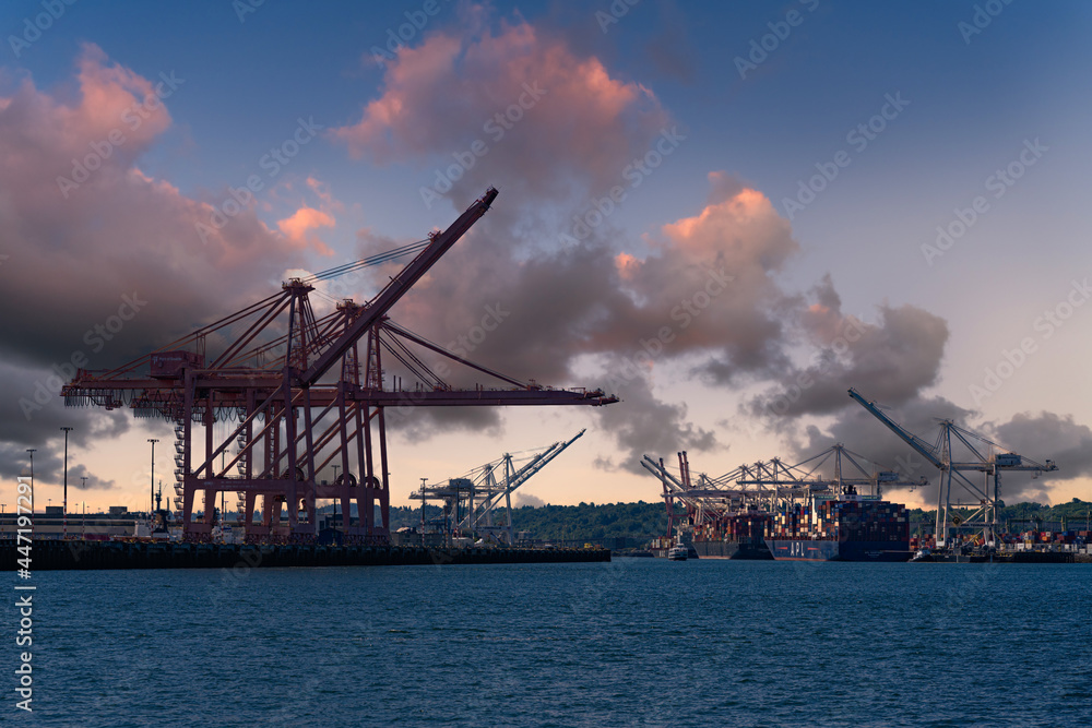 2021-07-25 LOADING DOCK AND CRANES ON HARBOR ISLAND IN SEATTLE WASHINGTON WITH BEAUTIFUL CLOUDS
