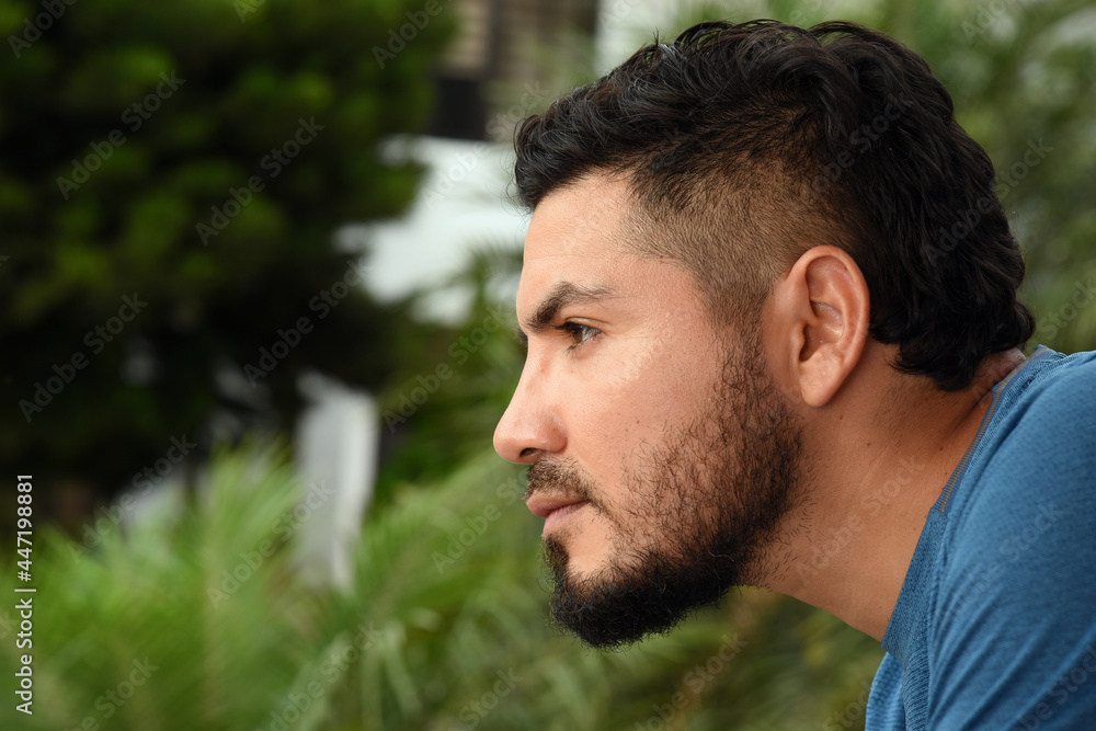Fototapeta premium man looking out a window from home, pensive