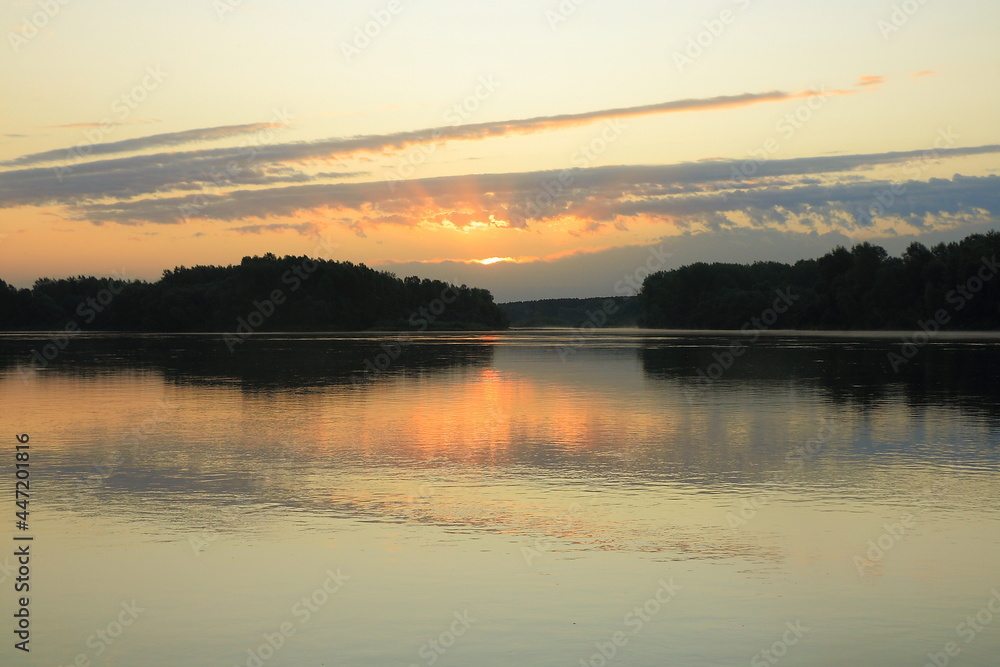 Orange dawn over the great Siberian river Biya