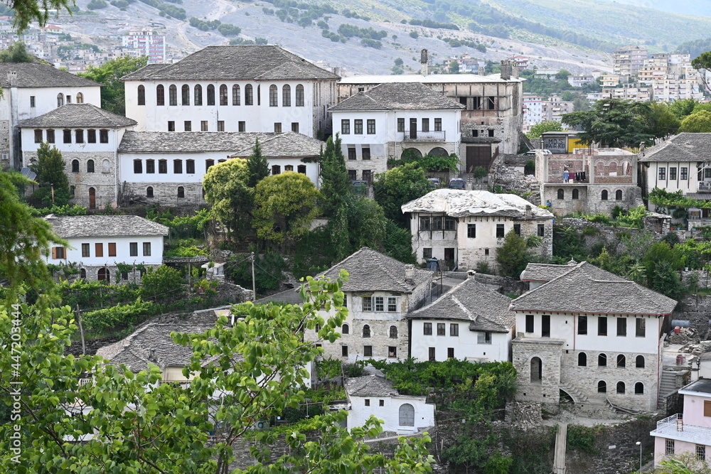 Obraz premium View of the old town of Gjirokastra in Albania with the traditional stone roofs, stone house roof 