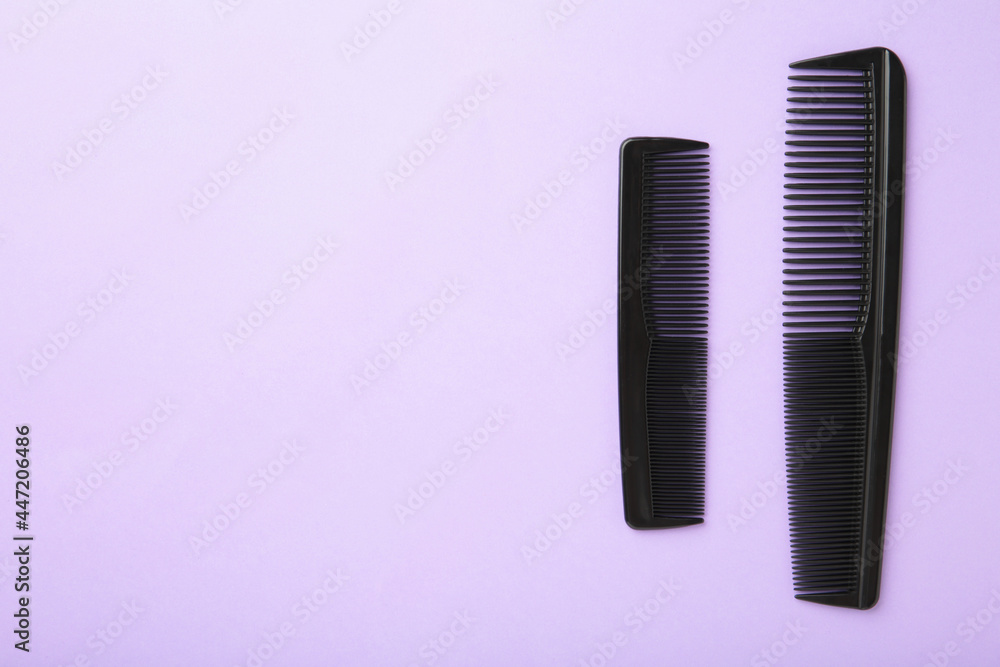 Two comb on a purple background. Device for combing hair. Two comb on a purple background. Device for combing hair.