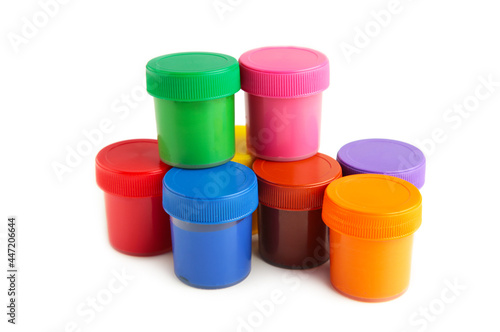 Set of colorful gouache jars isolated on white background. With copy space.