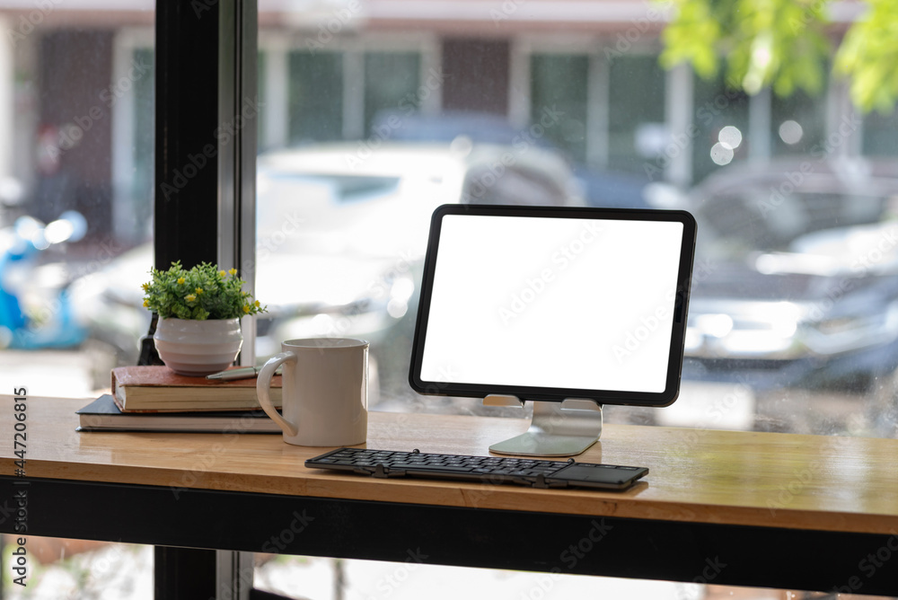 Tablet blank white screen with keyboard placed on desk. Tablet blank white screen with keyboard placed on desk.