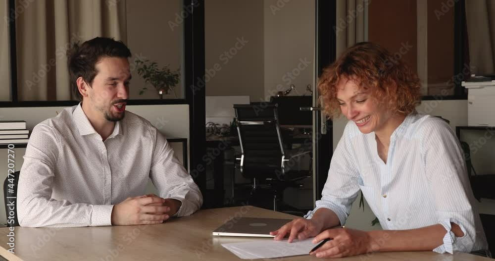 Two business partners or client and manager during formal meeting discussing agreement details, negotiating paper contract terms conditions, analyzing partnership, job interview hiring process concept Two business partners or client and manager during formal meeting discussing agreement details, negotiating paper contract terms conditions, analyzing partnership, job interview hiring process concept