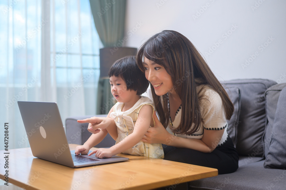 Happy mom and daughter relaxing at home Happy mom and daughter relaxing at home