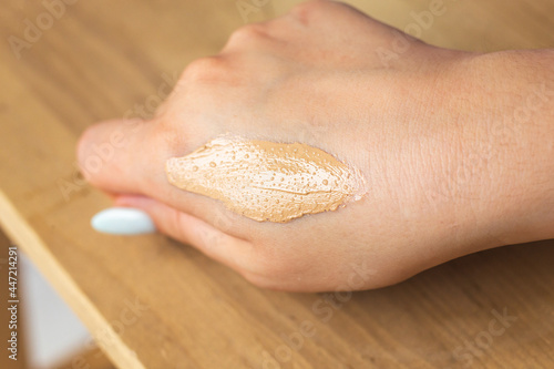 Moisturizing cream texture on women's hand