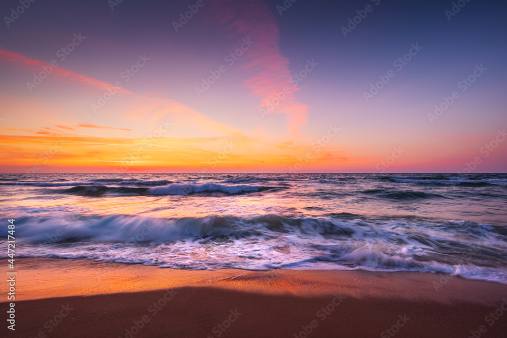 Beach sunrise over the sea