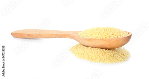 Scoop with raw couscous on white background