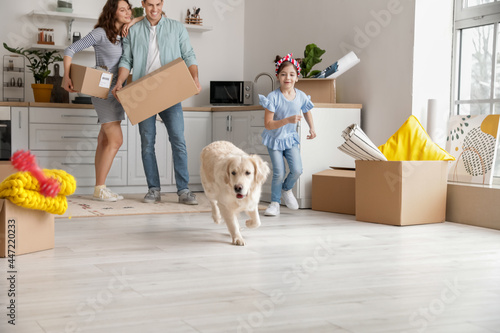 Happy family with dog and b...