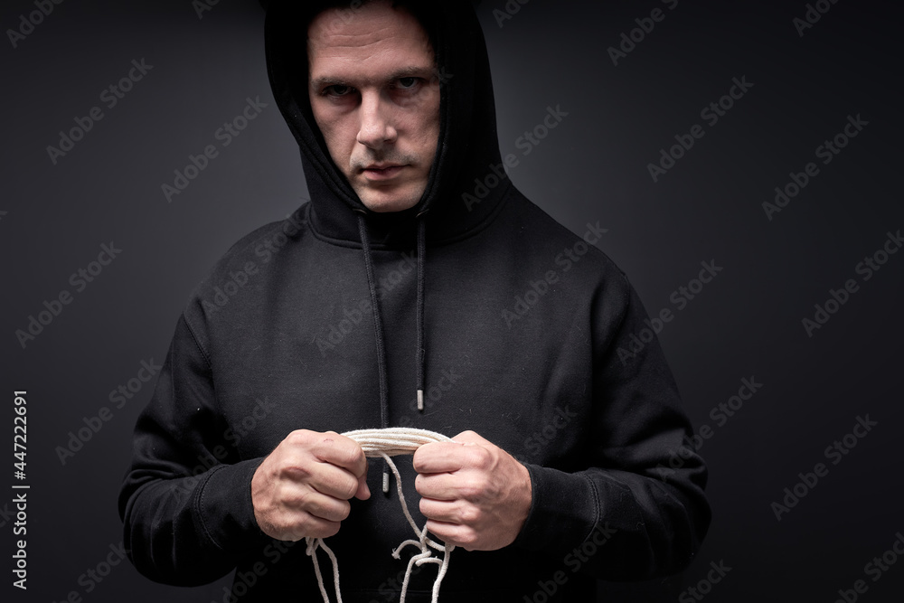 Serial Killer With Rope In Hands Looking At Camera Commit Crime