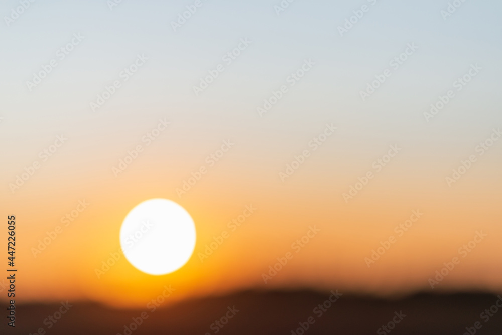 Blurred sunset landscape.Summer holiday concept. blurry beautiful sunlight and golden sunset background.