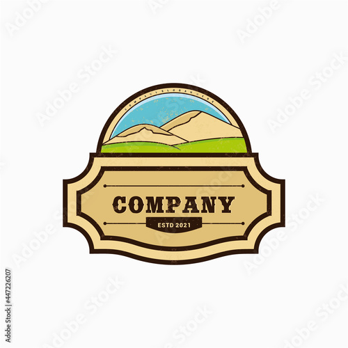 Beautiful mountain scenery logo design template. Natural mountain with green and wide savanna. Western Emblem Badge style logo