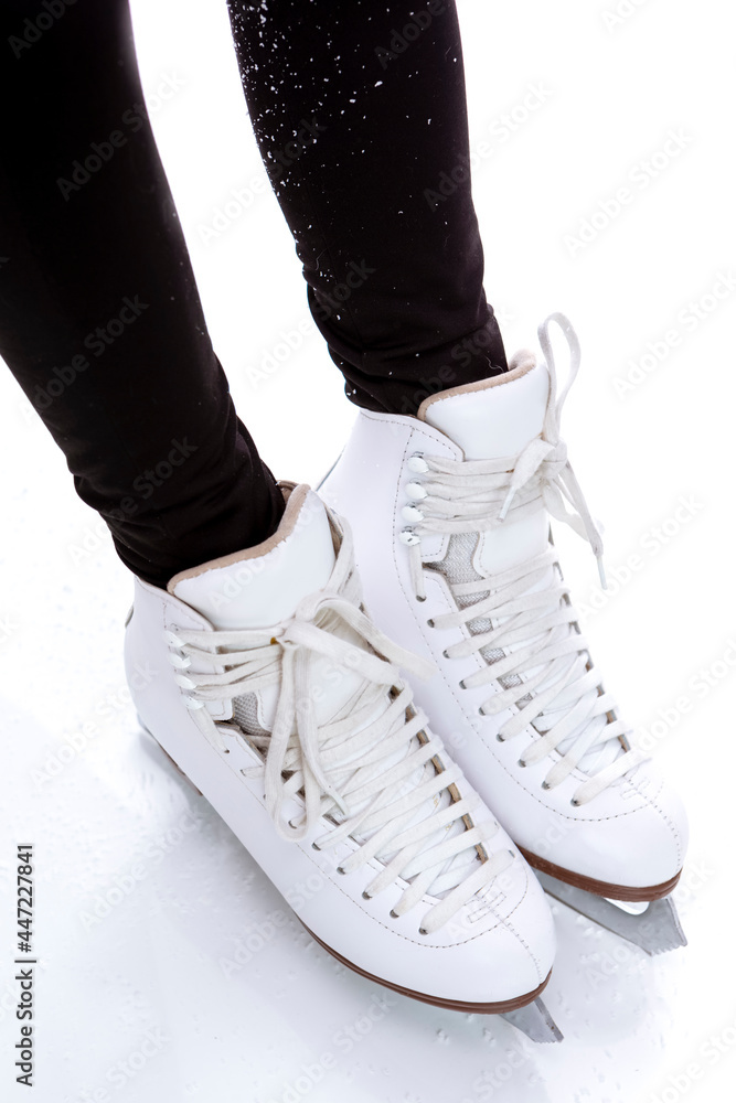 Closeup of Youth Female Ice Skates Boots Against White Background. Closeup of Youth Female Ice Skates Boots Against White Background.