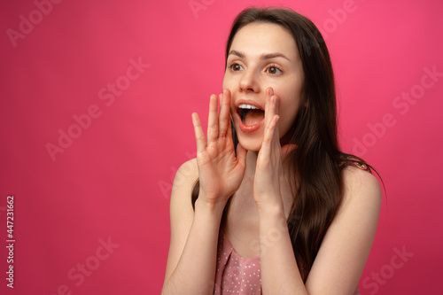 Portrait of a young woman shouting close up
