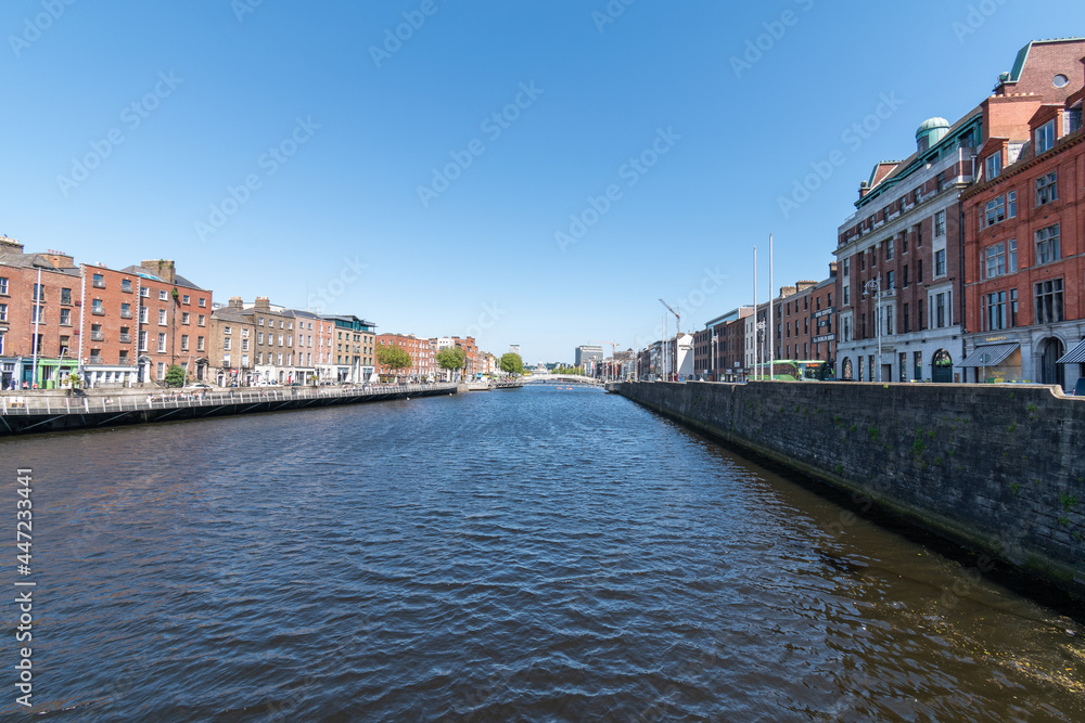 River Liffey and colorful buildings at summer day in Dublin, Ireland