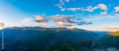 Aerial View of mountain and green forest at sunset in Xinjiang China.