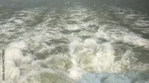 A high angle shot of waves after launch ride on Meghna River in Barishal in Bangladesh photo