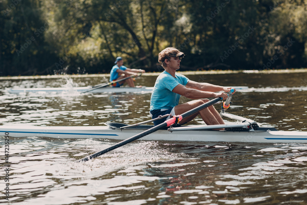 Sportsman single scull man rower rowing at competition boat regatta river - obrazy, fototapety, plakaty 