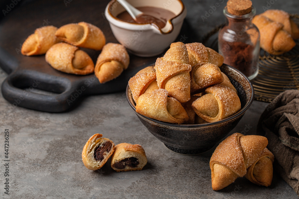 Filled pastries - rugelach or kipferl. Made with butter and cream cheese doughs with hazelnut chocolate cream. Filled pastries - rugelach or kipferl. Made with butter and cream cheese doughs with hazelnut chocolate cream.