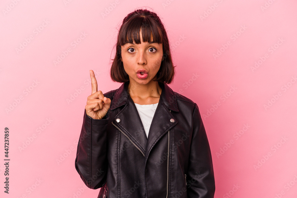 Young mixed race woman isolated on pink background having some great idea, concept of creativity. Young mixed race woman isolated on pink background having some great idea, concept of creativity.