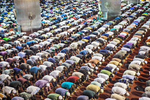 Muslim are Praying together in Istiqlal Mosque, The Biggest Mosque in South East Asia, Jakarta, Indonesia photo