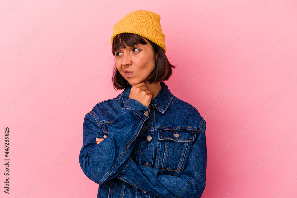 Young mixed race woman isolated on pink background suffers pain in throat due a virus or infection. Young mixed race woman isolated on pink background suffers pain in throat due a virus or infection.