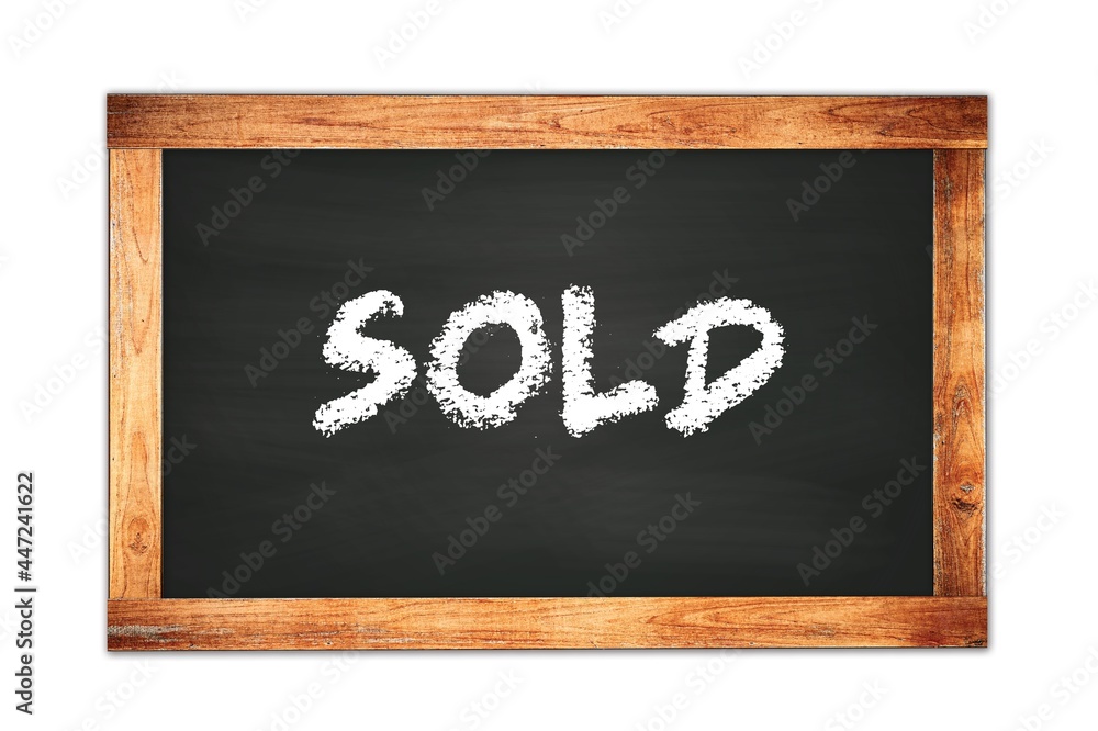 SOLD text written on wooden frame school blackboard. SOLD text written on wooden frame school blackboard.